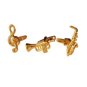 Gold cufflinks in the shape of a treble clef, trumpet, and saxophone.